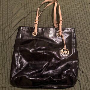 Michael Kors Jet Set Patent Leather Tote Bag in Black with Tan Straps.